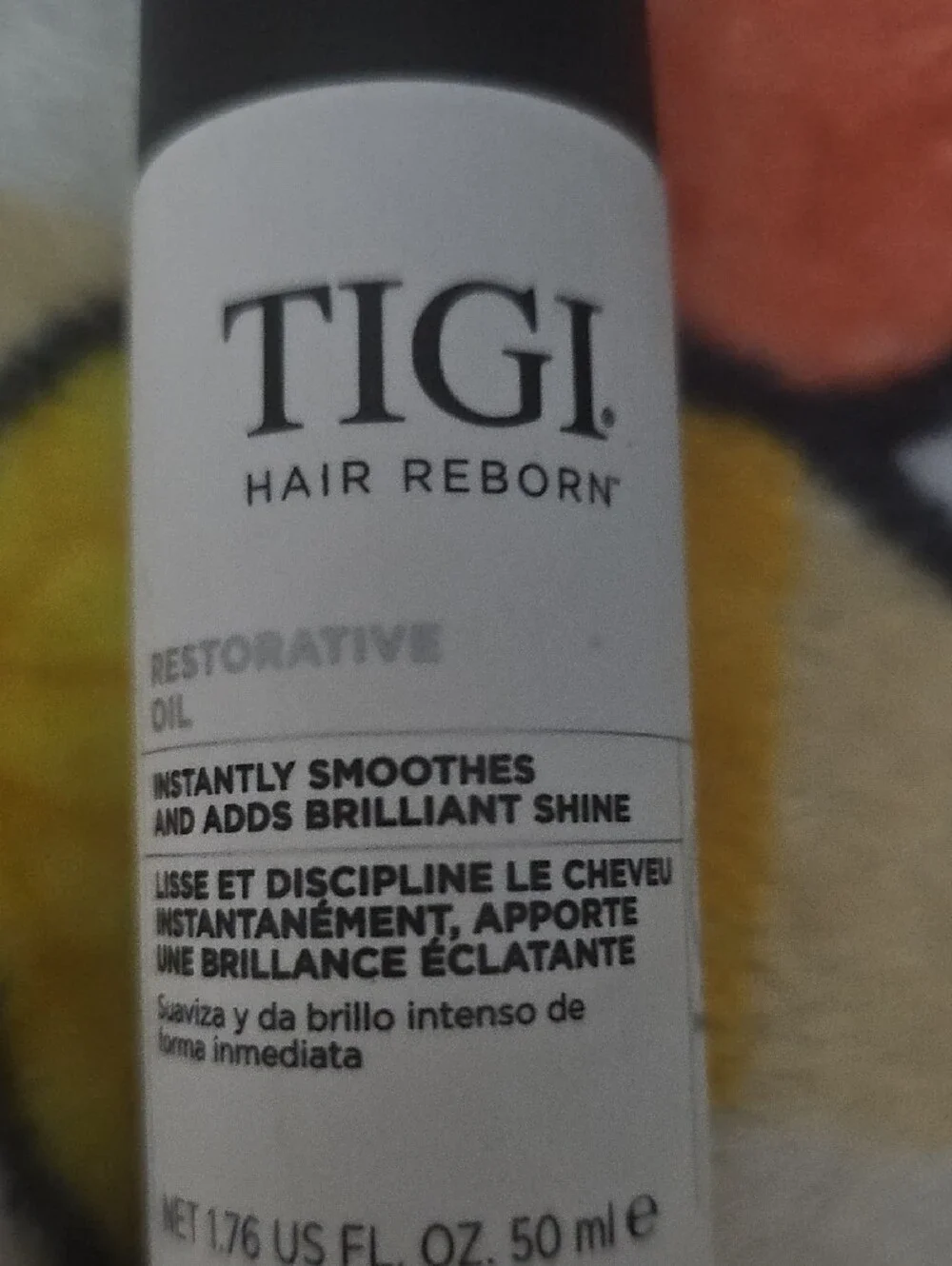 TIGI Hair Reborn Restorative Oil — White and Black Bottle